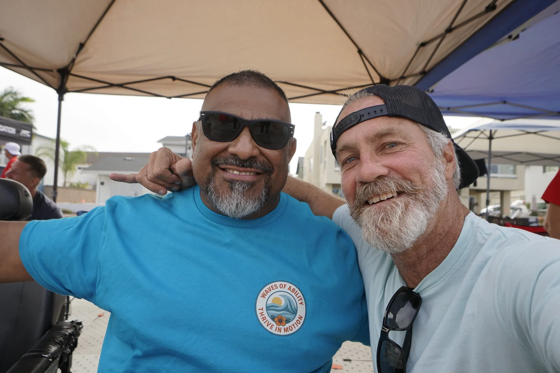Two members of the AFF community smiling together at a Paddle Day