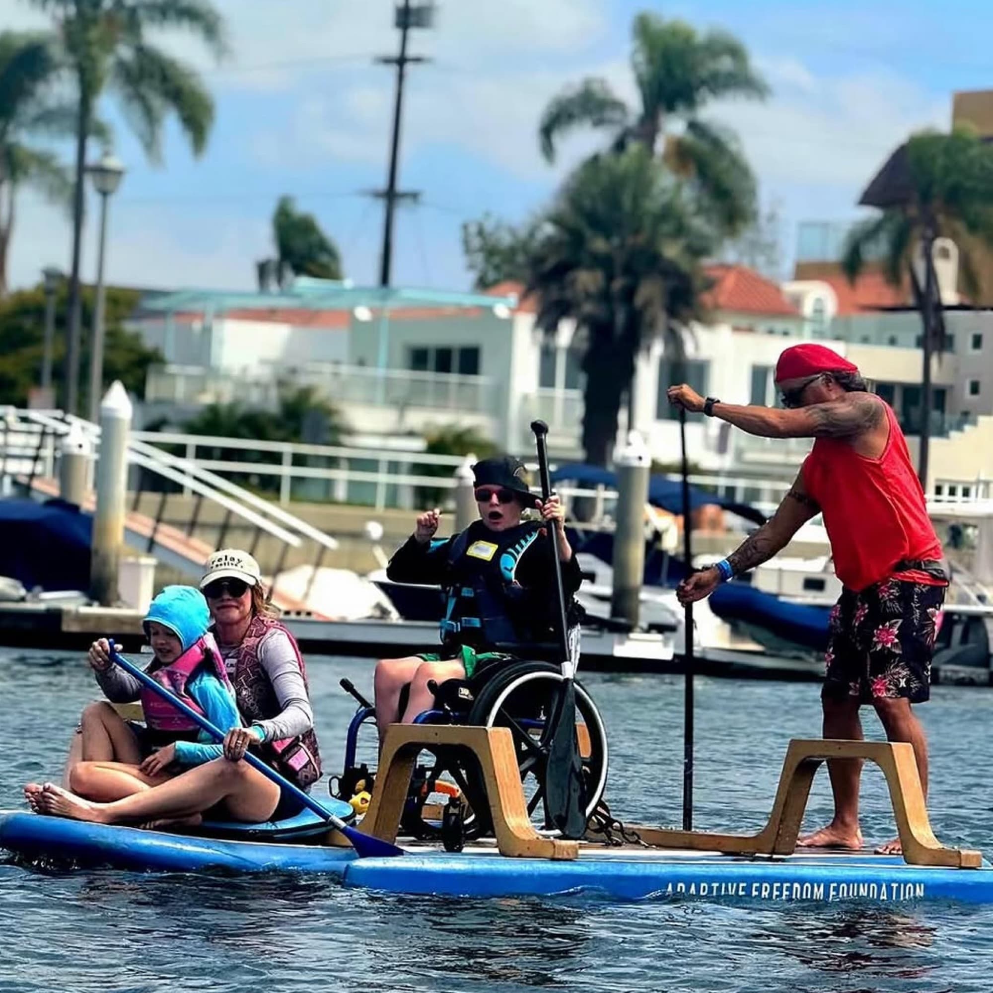 Adaptive Freedom Foundation participants and volunteers paddle together